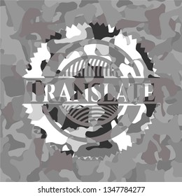Translate grey camouflaged emblem