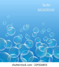 Transparent air bubbles in water on blue background