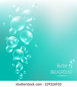 Transparent air bubbles in water on cyan background