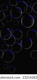 transparent balls illuminated by a key light on a black background, vertical composition