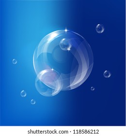 Transparent bubbles on blue background