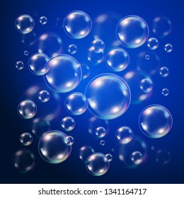 Transparent bubbles over dark blue background