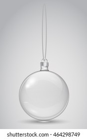 Transparent Christmas ball on a white background. Template Christmas toys. Vector realistic object.  Glass bead and thread. 10 EPS