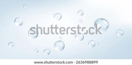 Transparent drops isolated on light blue background. Clear bubbles design elements.