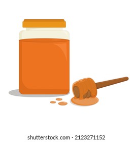 transparent glass jar of fragrant bee honey and a wooden stick