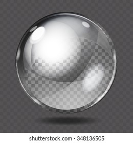 Transparent glass sphere with glares and shadow on the dark background