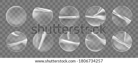 Transparent round adhesive stickers mock up set isolated on transparent background. Plastic crumpled round sticky label with glued effect. Template of a label or price tags. 3d realistic vector mockup 商業照片 © 