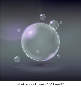 Transparent soap vector bubbles on a gray background
