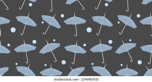 Transparent umbrellas with drops on gray background, seamless endless pattern. The topic of autumn, November, October. Protection from rain, storm. Print on clothes, wallpaper.