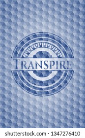 Transpire blue badge with geometric pattern.