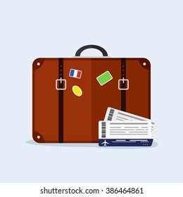 Transportation and travel. Suitcase with stickers, airplane tickets. Vacation tourism.