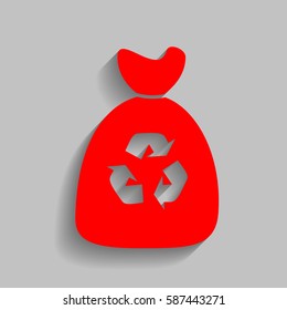 Trash bag icon. Vector. Red icon with soft shadow on gray background.