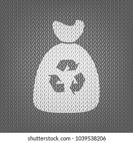 Trash bag icon. Vector. White knitted icon on gray knitted background. Isolated.