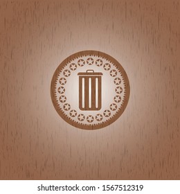 trash can icon inside badge with wood background