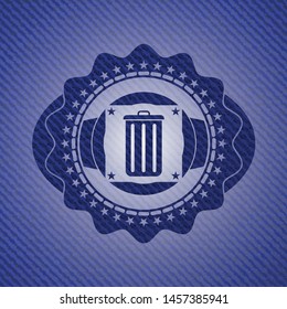 trash can icon inside emblem with denim texture