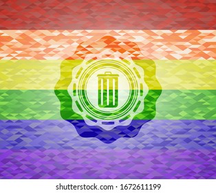 trash can icon inside emblem on mosaic background with the colors of the LGBT flag