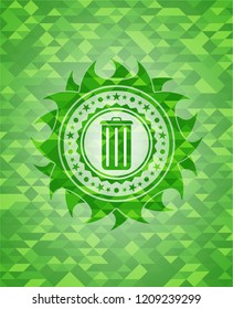 trash can icon inside green emblem with mosaic background
