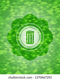 trash can icon inside green emblem. Mosaic background