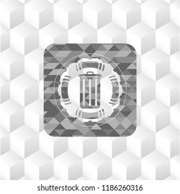 trash can icon inside grey badge with geometric cube white background
