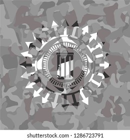 trash can icon inside grey camo emblem