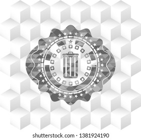 trash can icon inside grey emblem with geometric cube white background
