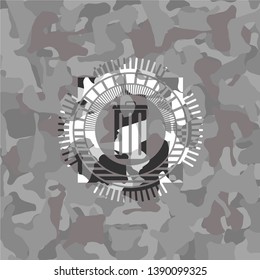 trash can icon inside grey camo emblem