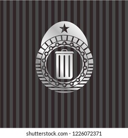 trash can icon inside silver emblem or badge
