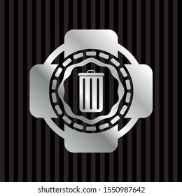 trash can icon inside silver badge or emblem