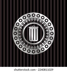 trash can icon inside silver emblem. 