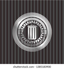 trash can icon inside silvery emblem