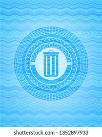 trash can icon inside water style emblem.