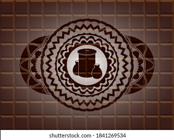trash icon inside chocolate emblem. Brown exquisite background. Illustration. 
