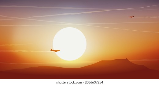 Travel and air transport concept with passing airliners in the sky at sunset.