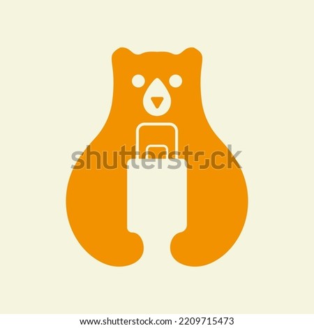 Travel Bag Bear Logo Negative Space Vector Template. Bear Holding Trophy Symbol