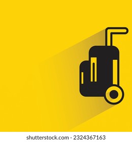 travel bag with shadow on yellow background