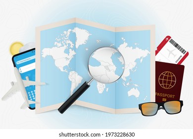 Travel destination Armenia, tourism mockup with travel equipment and world map with magnifying glass on a Armenia. Trip template.