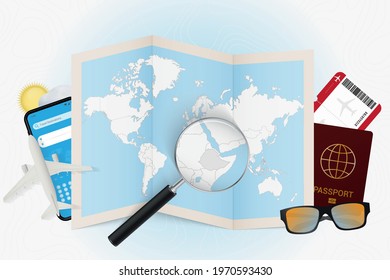 Travel destination Ethiopia, tourism mockup with travel equipment and world map with magnifying glass on a Ethiopia. Trip template.