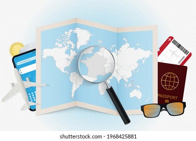 Travel destination France, tourism mockup with travel equipment and world map with magnifying glass on a France. Trip template.