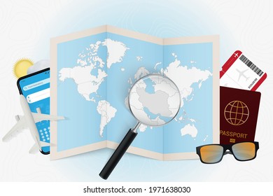 Travel destination Iran, tourism mockup with travel equipment and world map with magnifying glass on a Iran. Trip template.