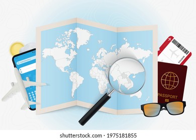 Travel destination Laos, tourism mockup with travel equipment and world map with magnifying glass on a Laos. Trip template.