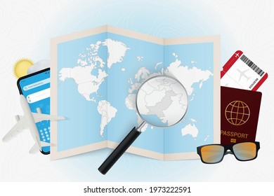 Travel destination Pakistan, tourism mockup with travel equipment and world map with magnifying glass on a Pakistan. Trip template.