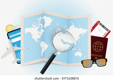 Travel destination Qatar, tourism mockup with travel equipment and world map with magnifying glass on a Qatar. Trip template.