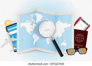 Travel destination Slovakia, tourism mockup with travel equipment and world map with magnifying glass on a Slovakia. Trip template.