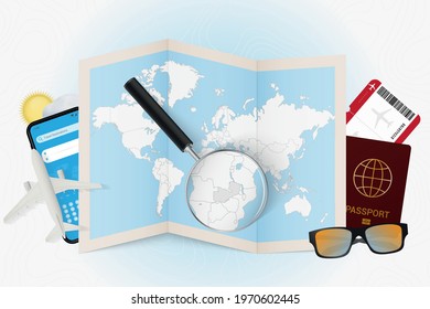 Travel destination Zambia, tourism mockup with travel equipment and world map with magnifying glass on a Zambia. Trip template.