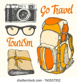 Travel hand-drawn set with sunglasses, camera, notepad, backpack. Vector illustration in sketch style on white background. Brush calligraphy elements for your design. Handwritten ink lettering.