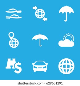 Travel icons set. set of 9 travel filled icons such as umbrella, car, qround the globe, pin on globe, sun, flip flops, binoculars with dollar sign