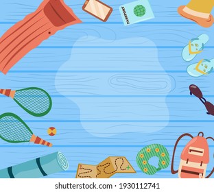 Travel items frame on wooden background. Objects for travelling around the world. Flat design style vector illustration collection of planning a summer vacation, tourism and journey objects.