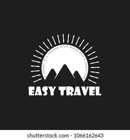 Travel Logo in flat style with mountains on the sunset background, in black and white colors