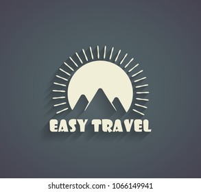Travel Logo with mountains on the sunset background and shadow
