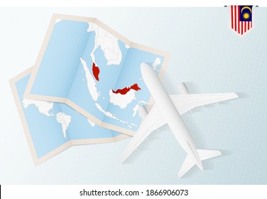 Travel to Malaysia, top view airplane with map and flag of Malaysia. Travel and tourism banner design.